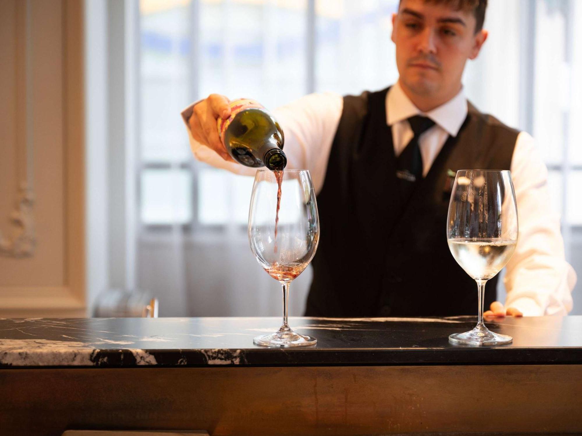 The Playford Adelaide - Mgallery Bagian luar foto A sommelier pouring wine